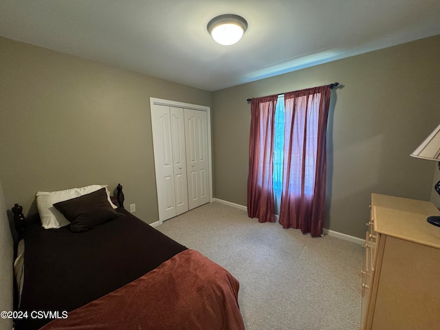 carpeted bedroom featuring a closet