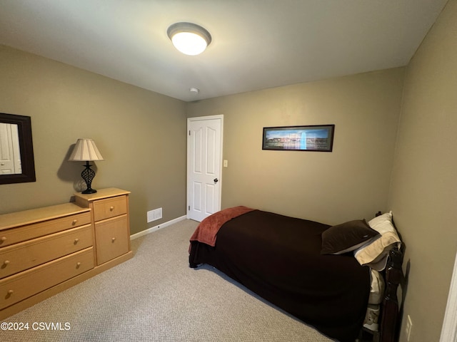 bedroom with light carpet