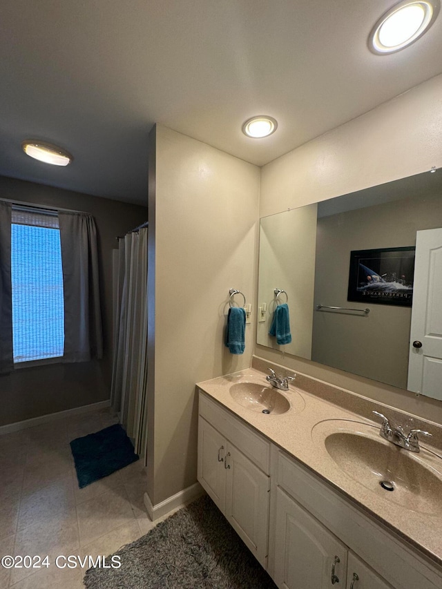 bathroom featuring vanity and tile patterned flooring