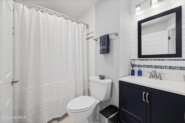 bathroom featuring vanity, a shower with shower curtain, tasteful backsplash, tile walls, and toilet