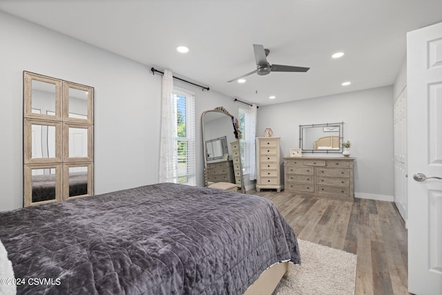 bedroom featuring light wood-type flooring and ceiling fan