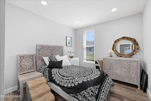 bedroom featuring dark hardwood / wood-style flooring