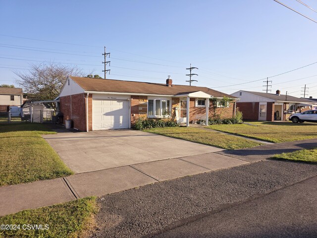 single story home with a garage and a front yard