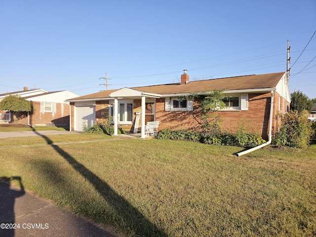 1000 E 6th St, Berwick, PA 18603 - single story home featuring a front lawn, a chimney, brick siding, and driveway