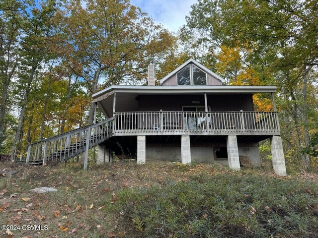 Simonds Hill Ln, Tioga, PA 16946 - rear view of house with stairway, a chimney, and a deck