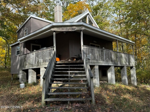 view of property exterior with a wooden deck