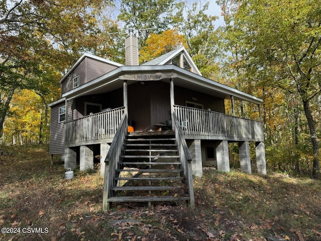 Simonds Hill Ln, Tioga, PA 16946 - view of side of home featuring a porch, a chimney, and stairs