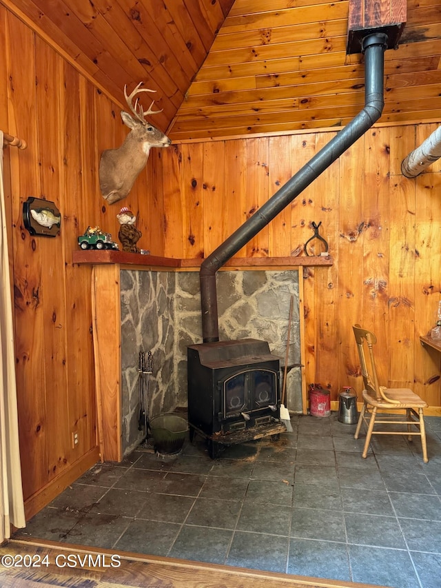 details featuring wood ceiling, wood walls, and a wood stove