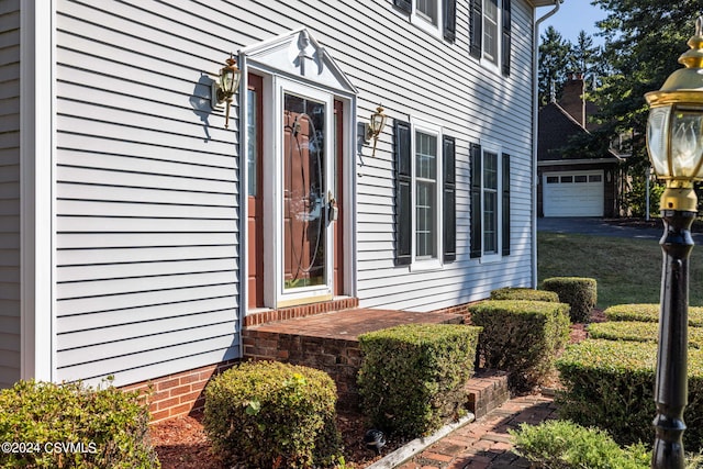 property entrance with a garage