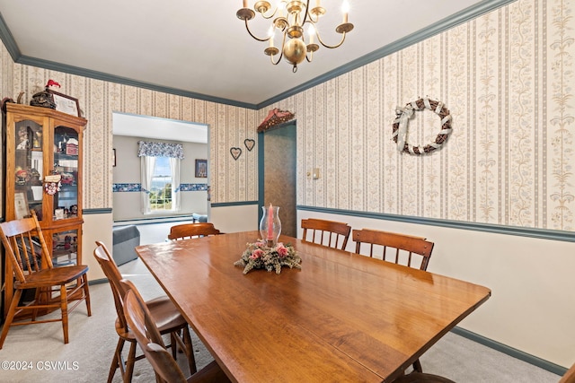 carpeted dining area featuring ornamental molding and a chandelier