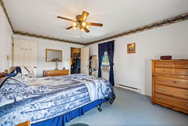 bedroom featuring a spacious closet, carpet floors, a closet, ceiling fan, and a baseboard radiator