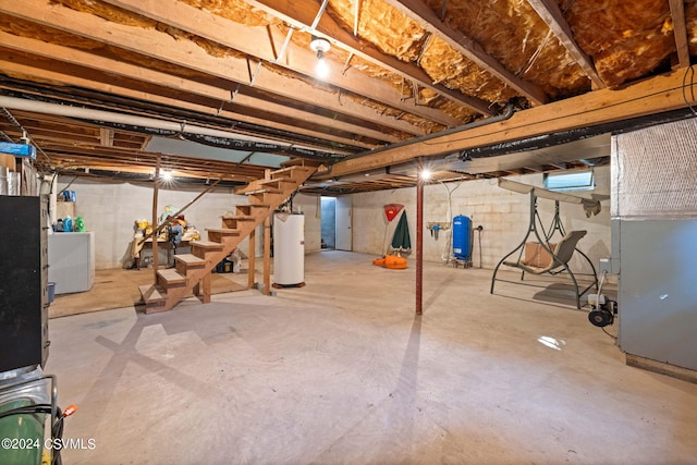 basement with gas water heater and washer / dryer