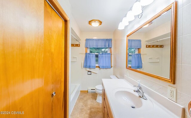 full bathroom featuring vanity, separate shower and tub, baseboard heating, tile walls, and toilet