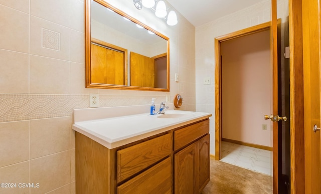 bathroom with tile walls and vanity