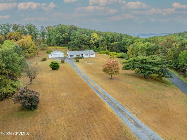 birds eye view of property with a rural view