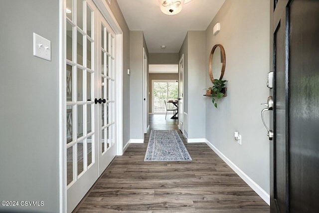 interior space with french doors and dark hardwood / wood-style flooring