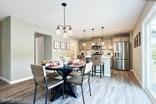 dining area featuring light wood-type flooring