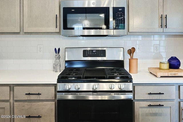 kitchen featuring decorative backsplash and stainless steel appliances