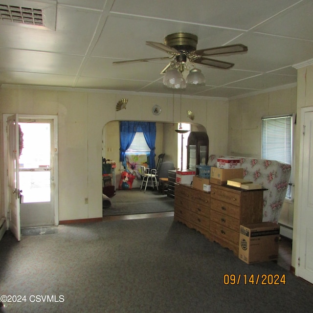 misc room with ceiling fan and crown molding