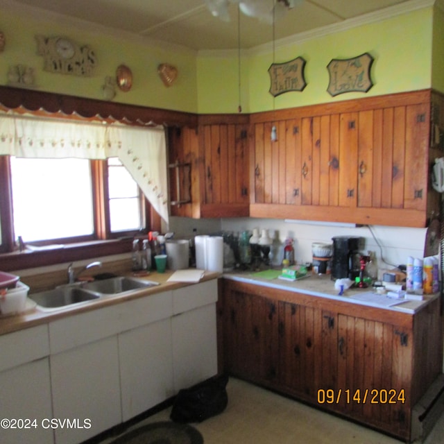 kitchen featuring white cabinets and sink