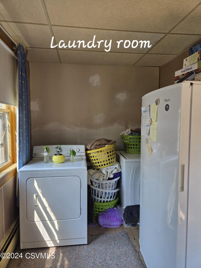 clothes washing area with separate washer and dryer