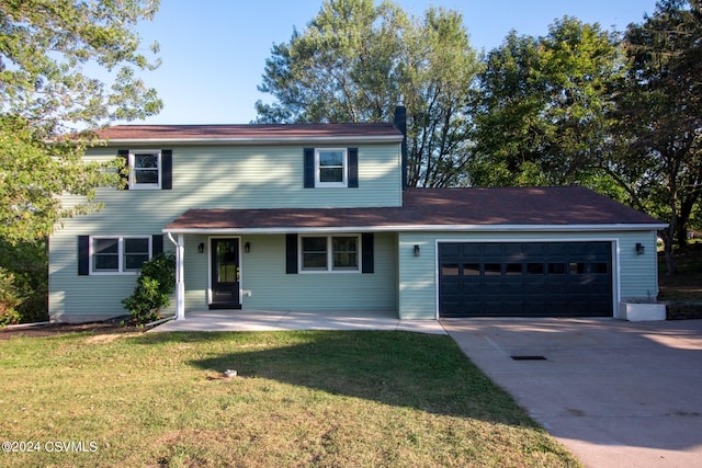 front facade with a front yard and a garage