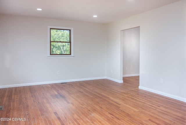 spare room featuring light wood-type flooring