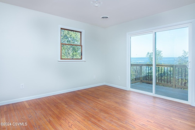 unfurnished room with light hardwood / wood-style flooring