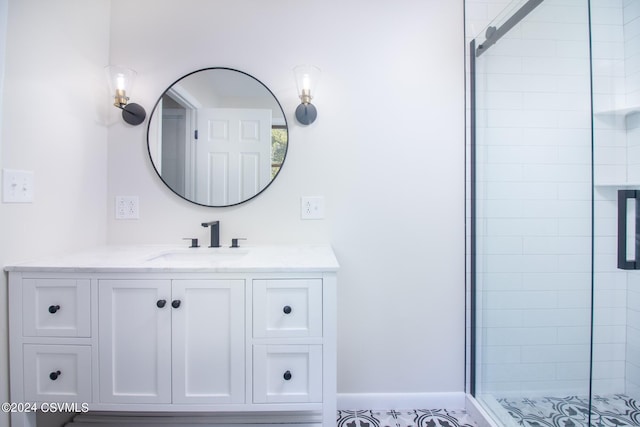 bathroom featuring vanity and an enclosed shower