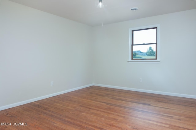 spare room with light wood-type flooring