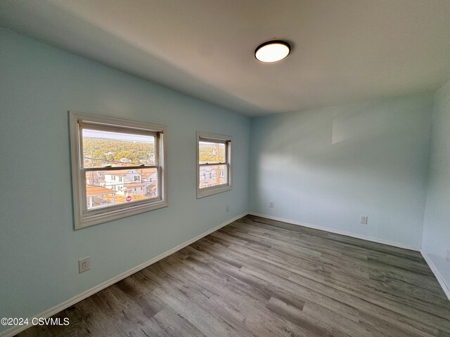 112 Green St, Edwardsville, PA 18704 - empty room featuring baseboards and wood finished floors