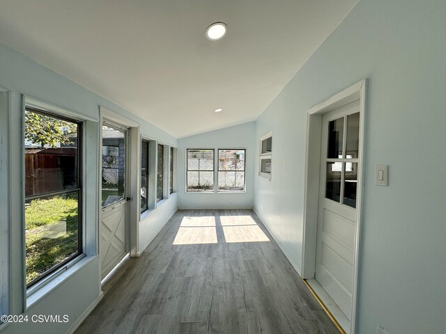 112 Green St, Edwardsville, PA 18704 - unfurnished sunroom featuring lofted ceiling, baseboards, wood finished floors, and recessed lighting