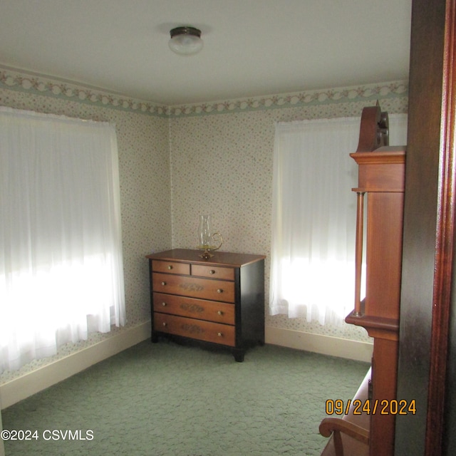 unfurnished bedroom featuring light carpet