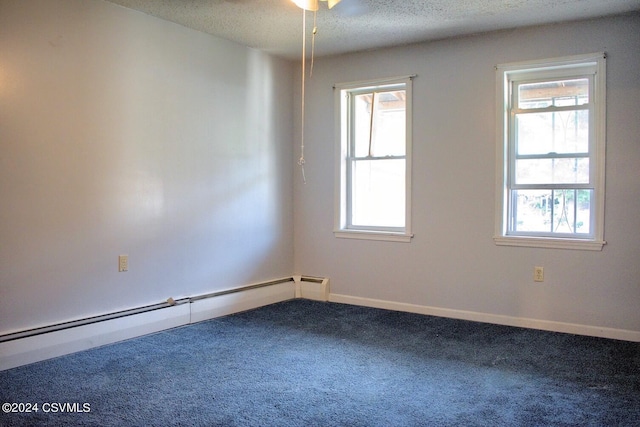 carpeted spare room featuring ceiling fan, a textured ceiling, and baseboard heating