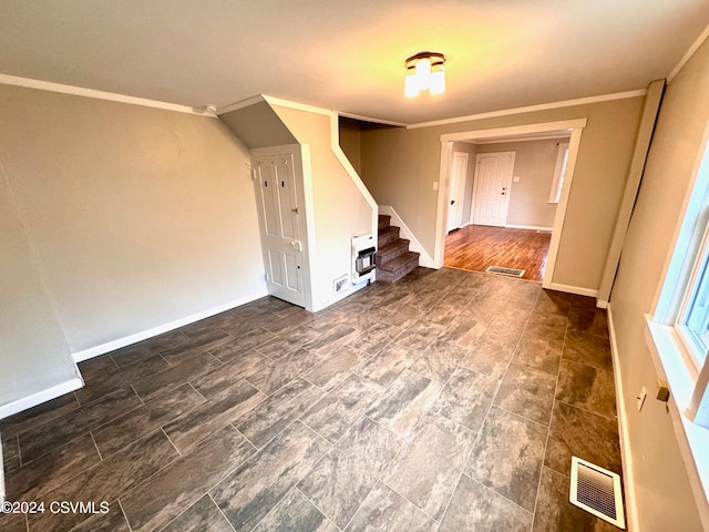 interior space with heating unit, dark wood-type flooring, and crown molding