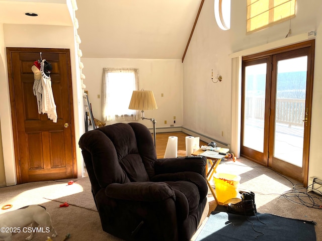 carpeted living area with french doors and vaulted ceiling