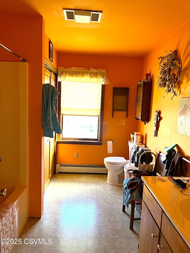 full bath with visible vents, toilet, tile patterned floors, baseboard heating, and vanity