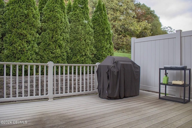 wooden deck featuring grilling area