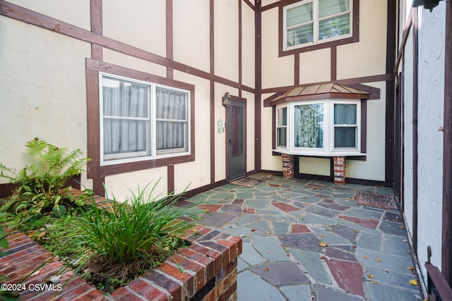 entrance to property with a patio area