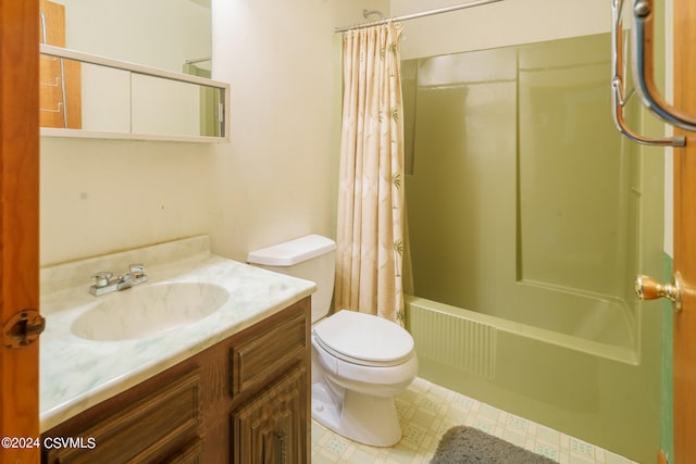 full bathroom featuring shower / bath combination with curtain, vanity, and toilet