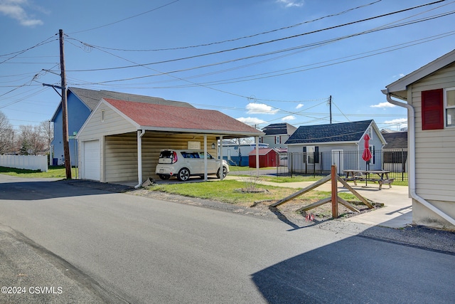 exterior space featuring a garage and a carport