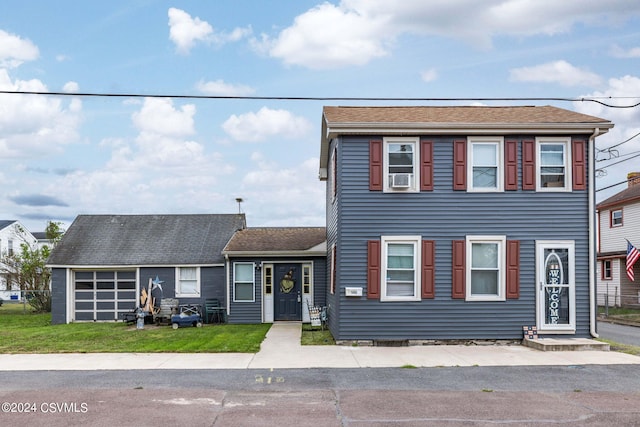 view of front of house with cooling unit and a front yard