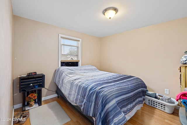 bedroom with wood-type flooring