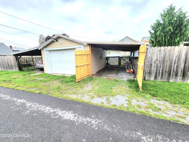 garage featuring a carport