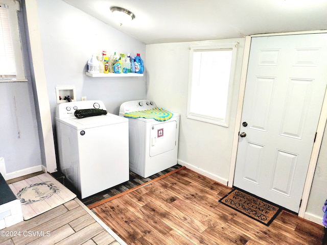 laundry room featuring dark wood-type flooring and independent washer and dryer