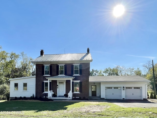 view of front of property featuring a garage and a front yard