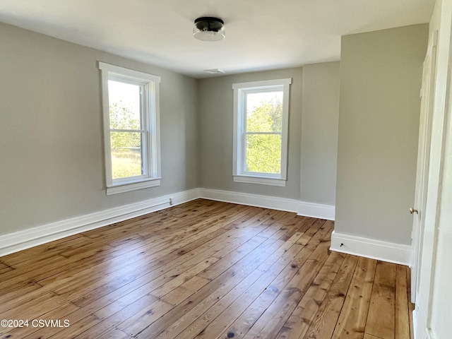 spare room with light hardwood / wood-style floors