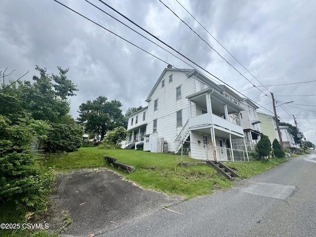 1442 Hemlock St, Coal Township, PA 17866 - view of side of home featuring a yard and stairway
