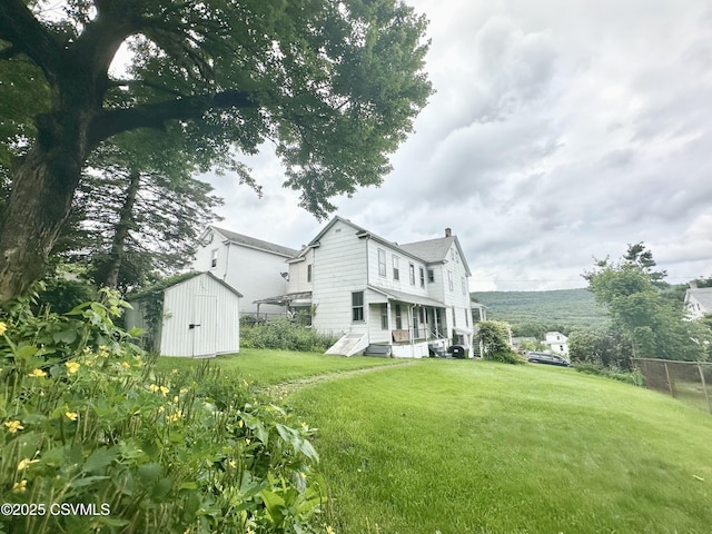 1442 Hemlock St, Coal Township, PA 17866 - back of house featuring a shed and a chimney