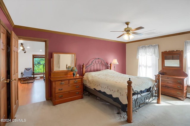 bedroom featuring crown molding, visible vents, a ceiling fan, and light carpet